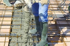 Warehouse smiling colleagues scanning cardboard box barcode and